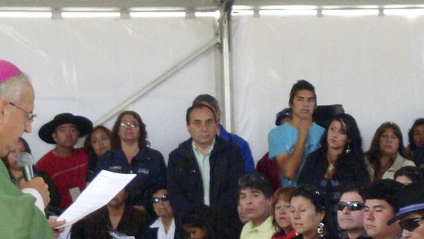 Some of the 33 Chilean miners attend a mass at the San Jose mine