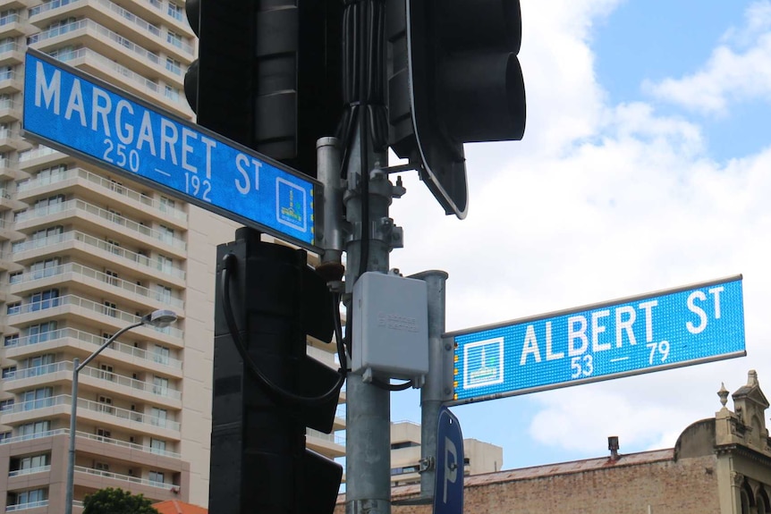 Street signs on corned of Margaret Street and Albert Street in Brisbane CBD