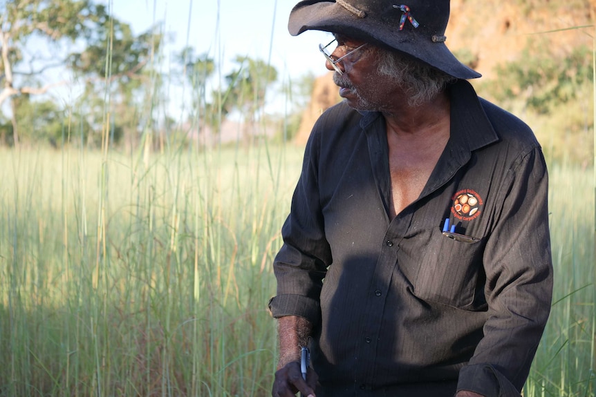 Aboriginal elder signing document