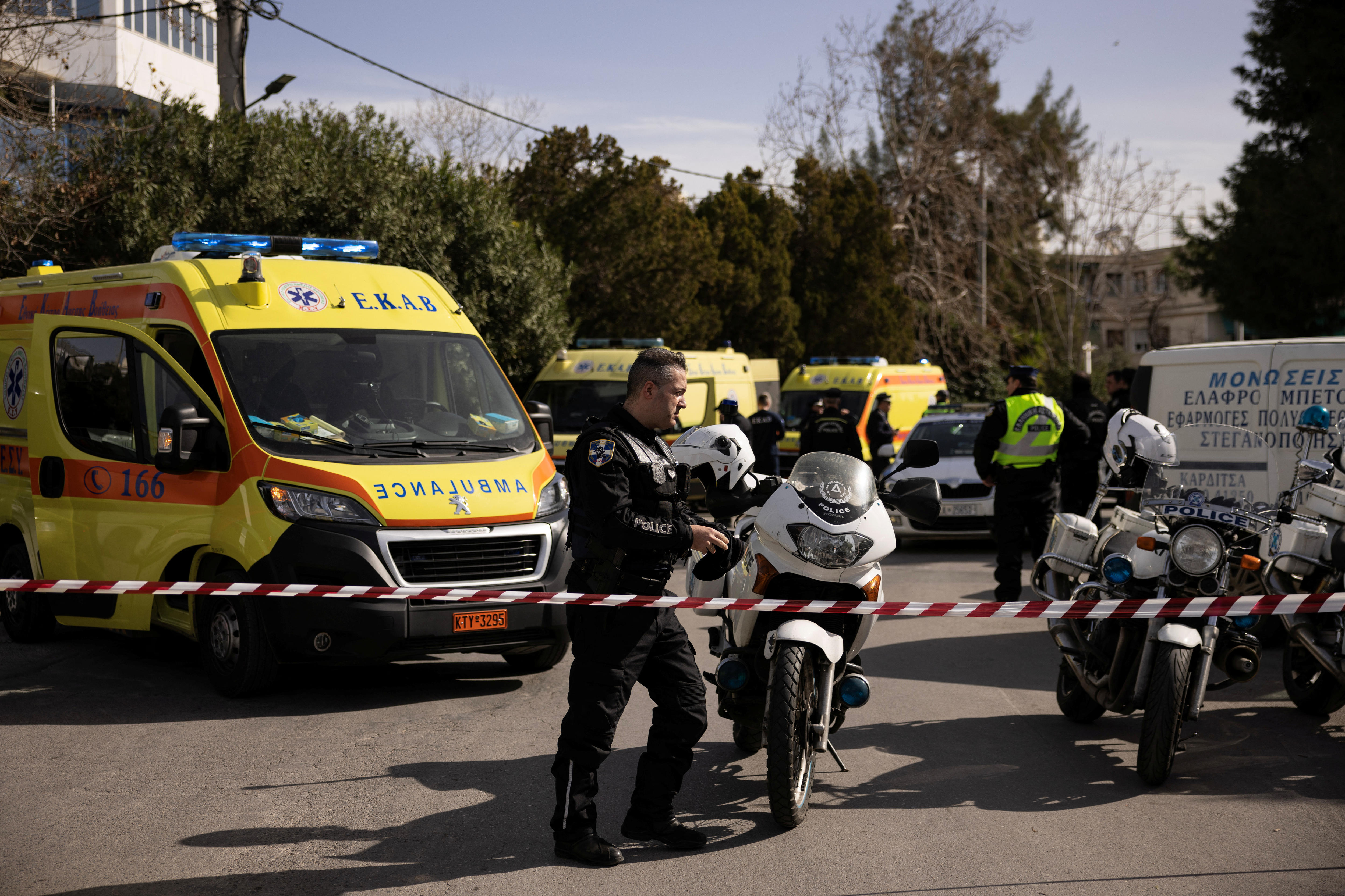Police officers secure the area around the building of a shipping company.