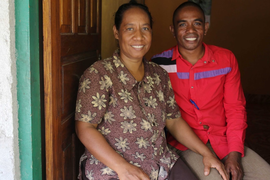 Alfonso Soares (right) and his wife sit beside one another.