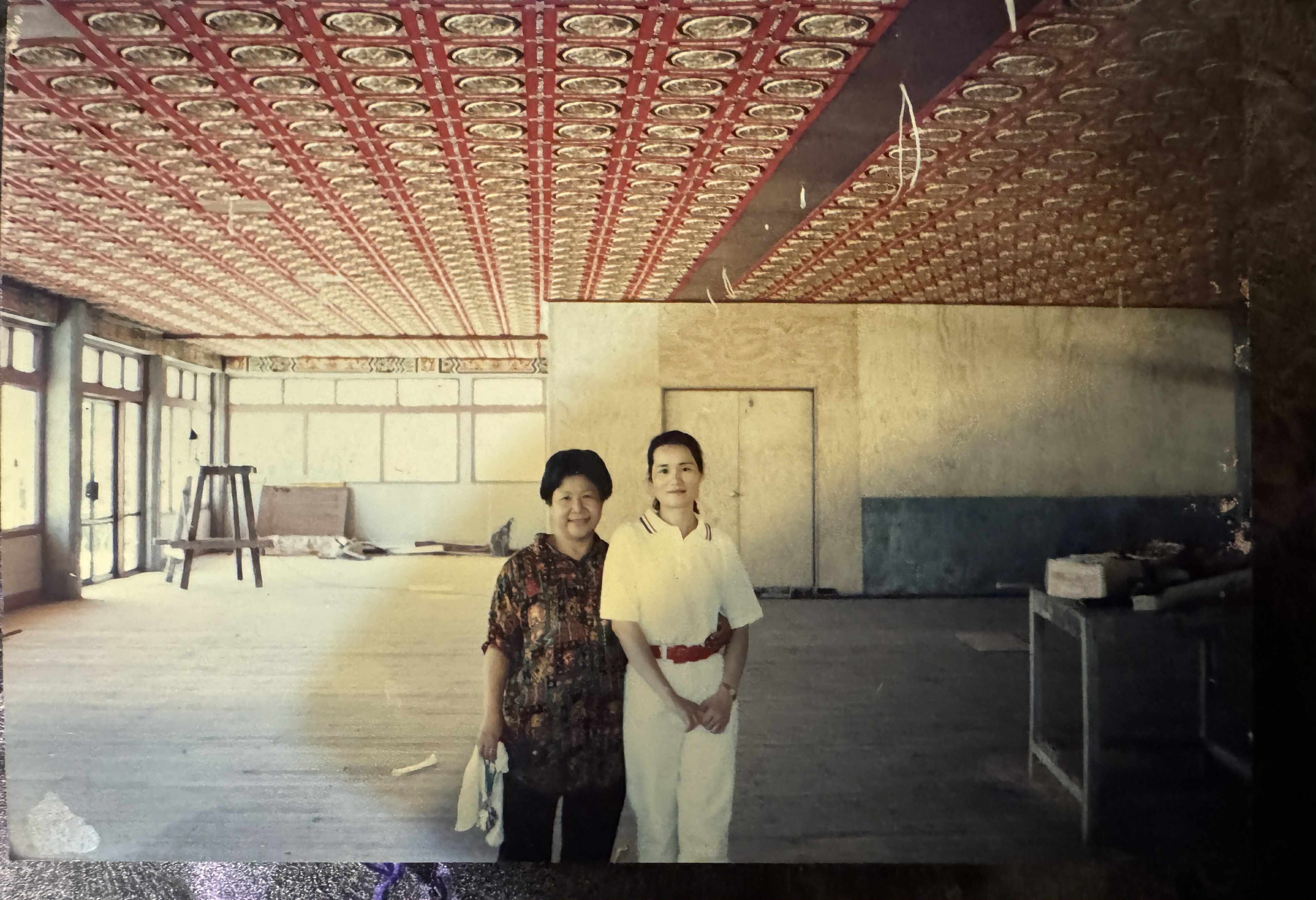 Stacey and her mother at the new Sea King restaurant during construction.