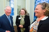 Louise Hardman in the foreground of a meeting with a laughing Prince Charles and others, in London, in 2018.