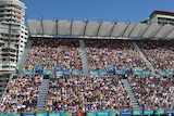 Crowds pack temporary swimming stands at the Gold Coast Commonwealth Games