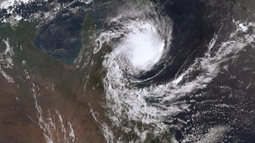 satellite image of large tropical cyclone gettting closer to the north queensland coast