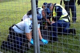 Protester arrested at Aboriginal tent embassy in Musgrave Park, South Brisbane.