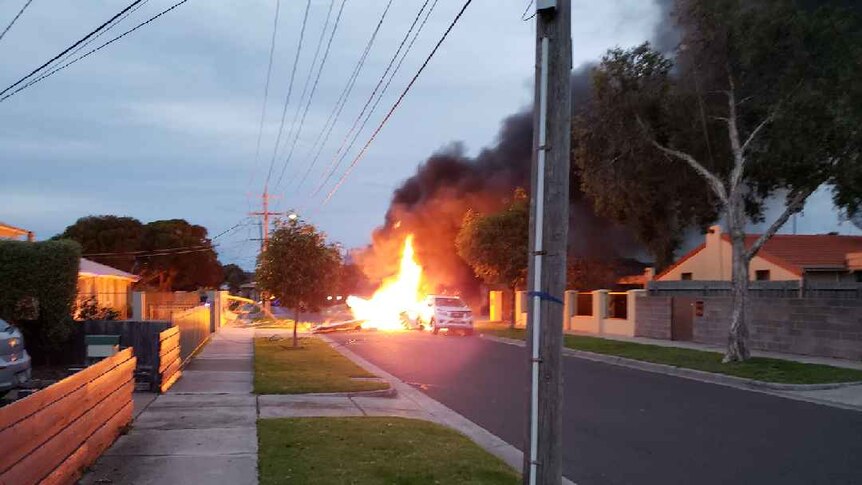 A plane bursts into flames as it crashes into a street at Mordialloc.