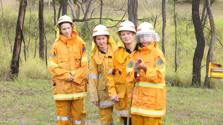 young firefighters holding hose