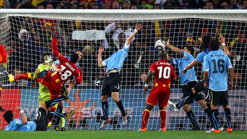 Luis Suarez handles the ball on the line to deny Ghana a certain goal in their World Cup quarter-final.