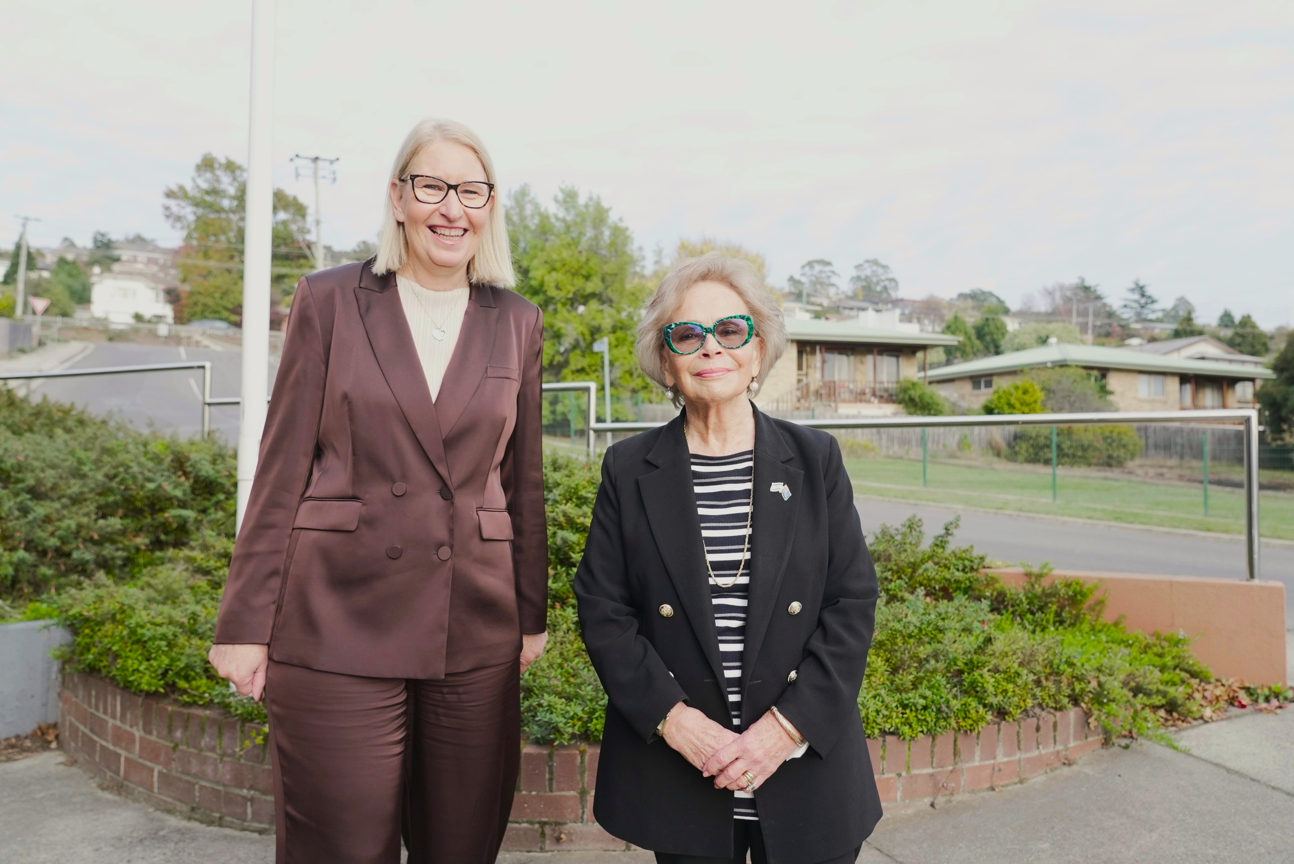 Two women pose for a photo.