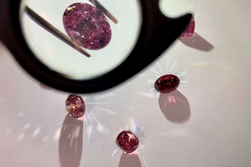 Close up of hero diamonds through magnifier