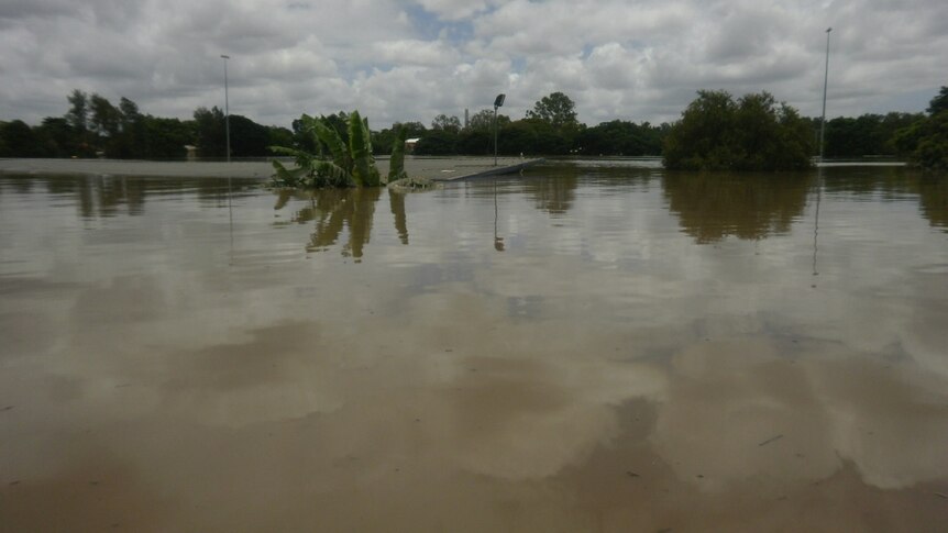 Floodwaters cover a Fairfield football field and clubrooms