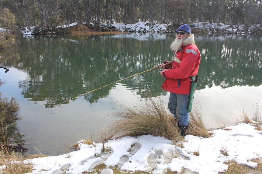 Fisherman Greg Pullen heads out in cold conditions