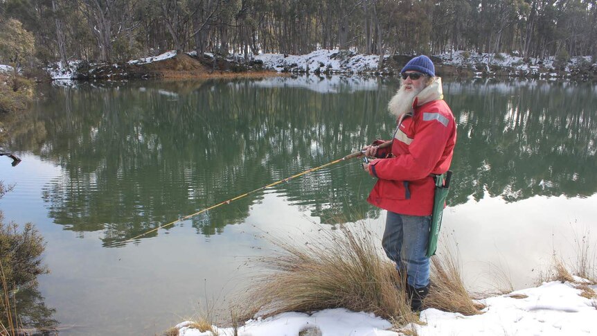 Fisherman Greg Pullen heads out in cold conditions