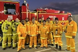 A group wearing CFA uniforms in front of a truck.
