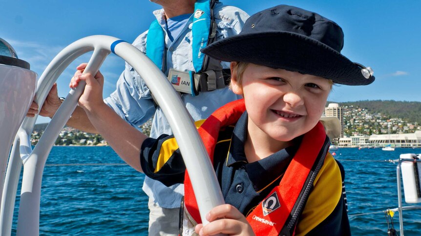 Arthur Coleman, 5, sails on a yacht in Hobart