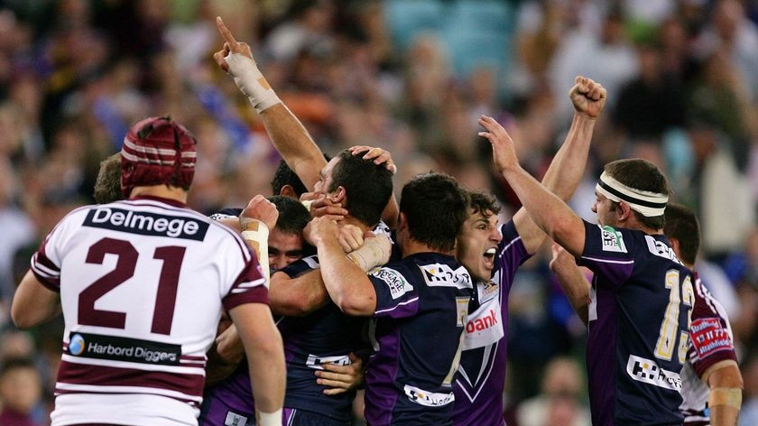Handy advantage ... Storm five-eighth Greg Inglis celebrates with team-mates after scoring Melbourne's second try
