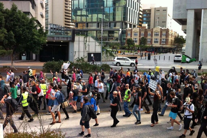 Protesters march against Qld government crackdowns