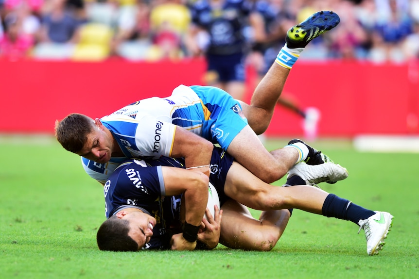Jake Clifford tackled by Mitch Rein