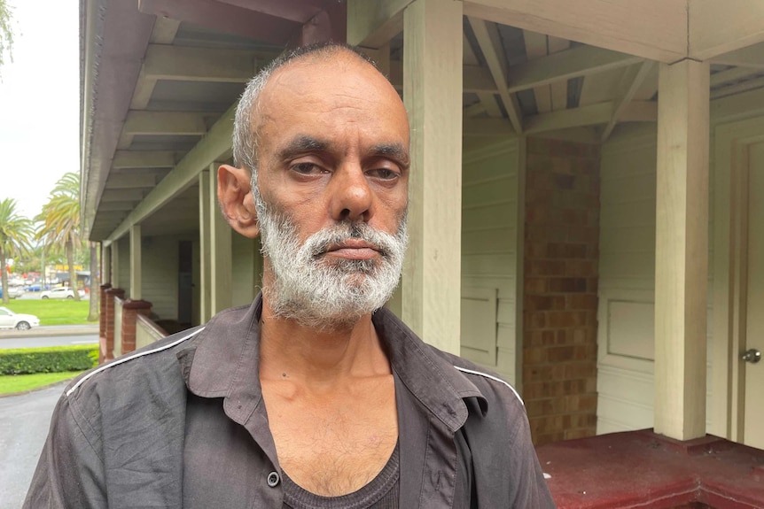 Indigenous Lismore man Robert Blundell stands outside the motel where he is staying.