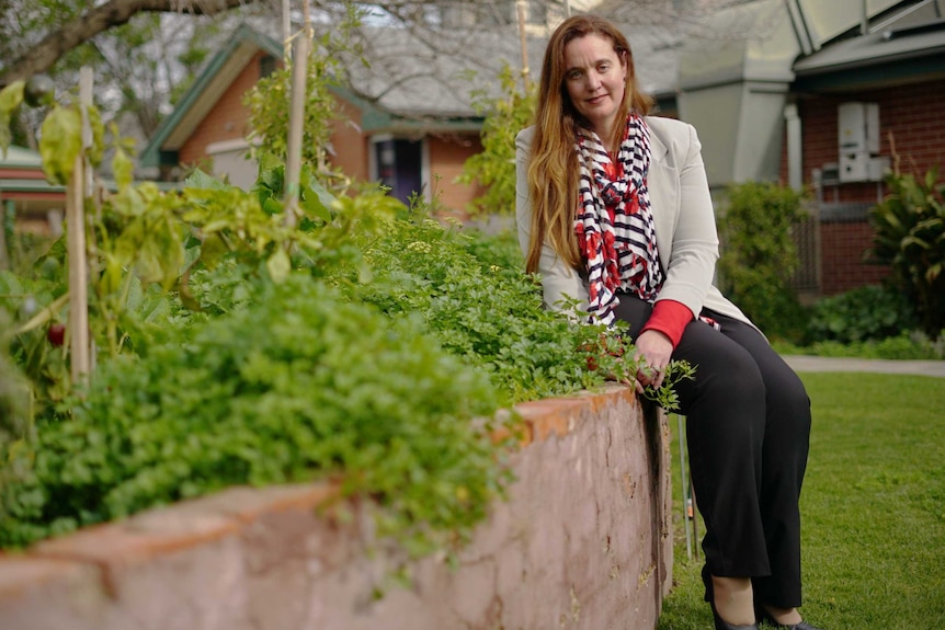 Mel Ottaway sits outside