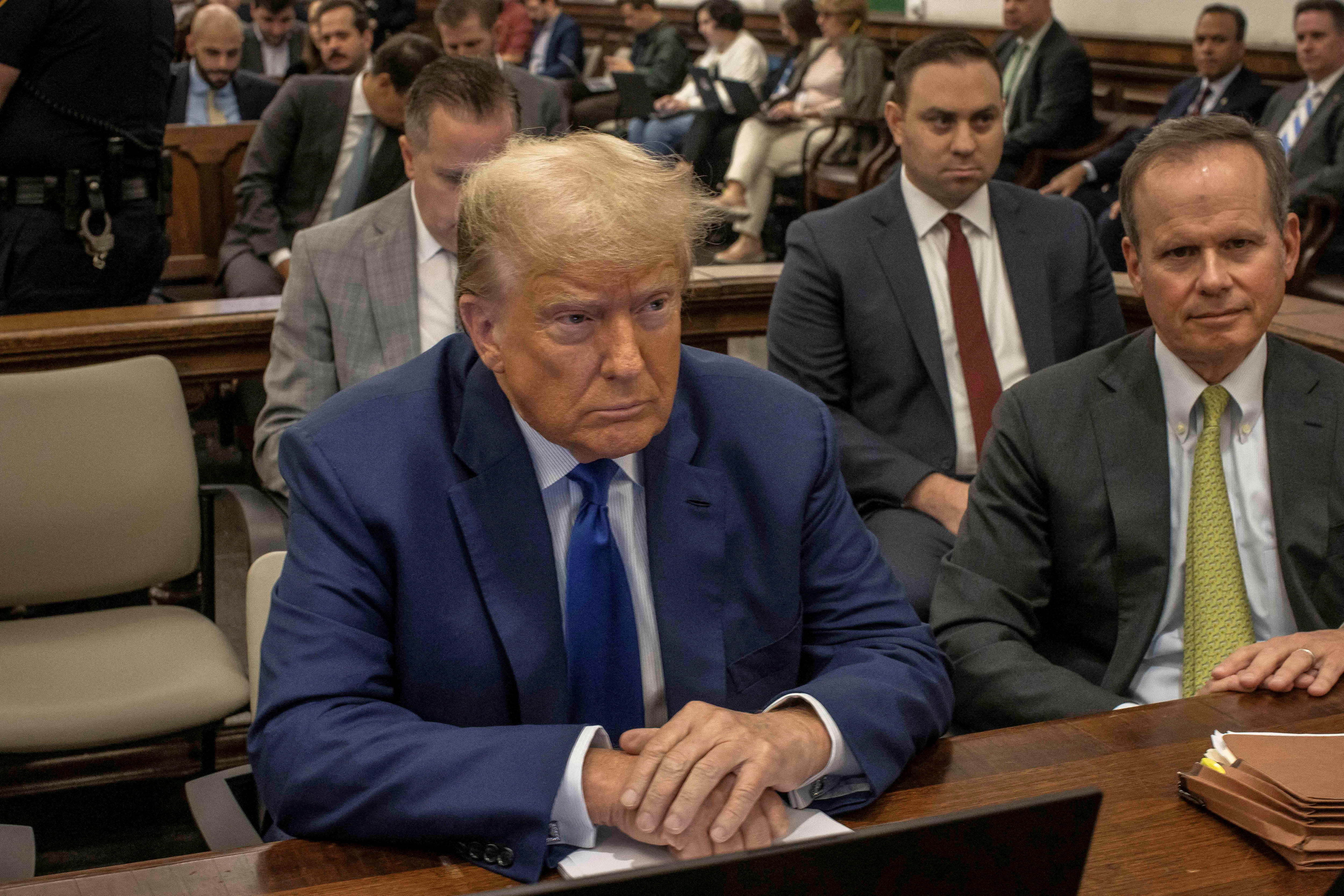 Donald Trump sitting in court. 