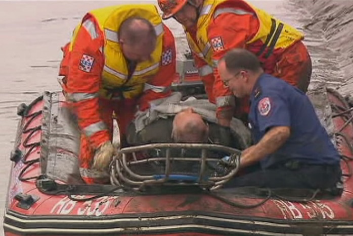 Rescuers take man from plane crash