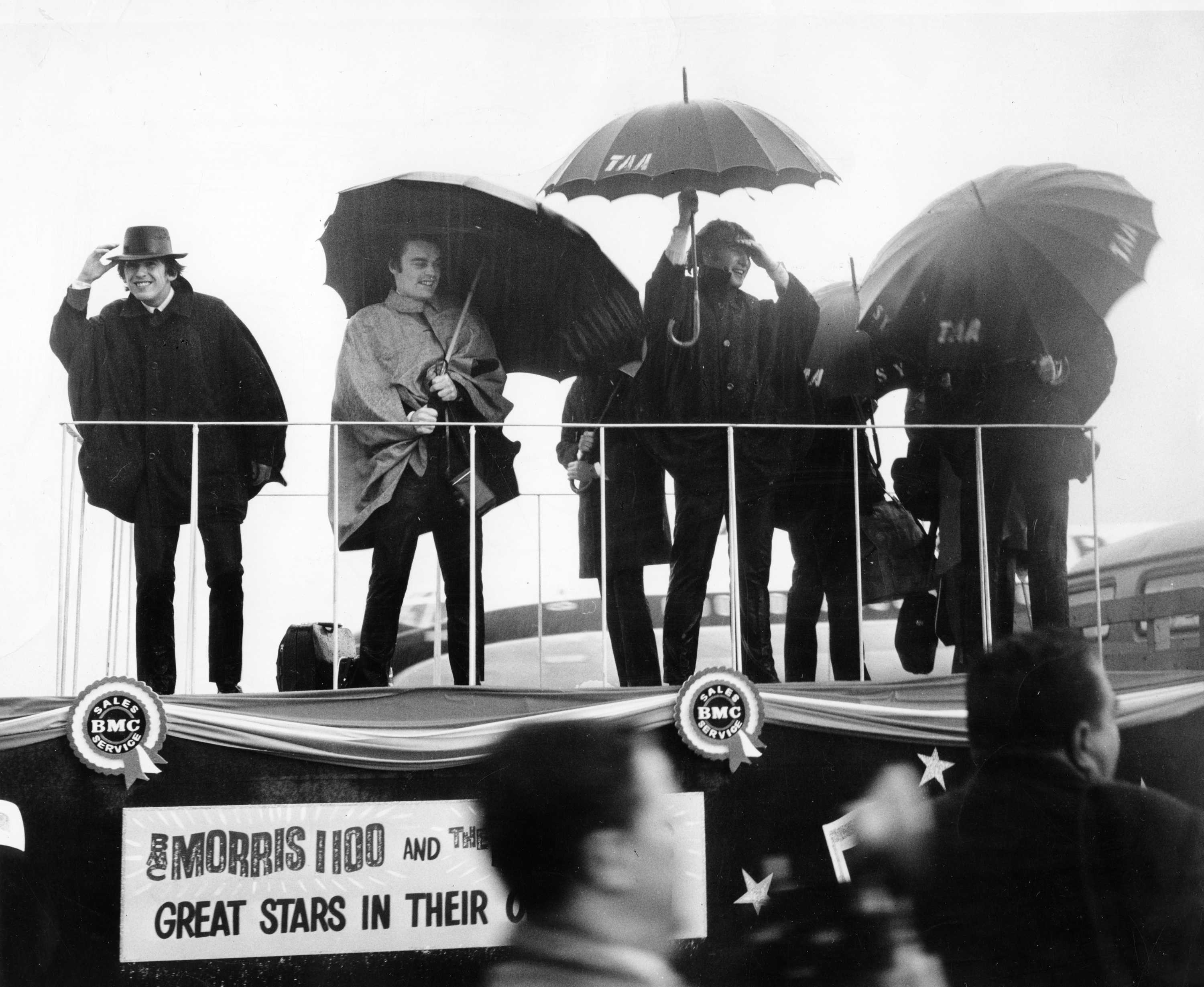 The Beatles brave the rain in Sydney, during their Australian tour in 1964.
