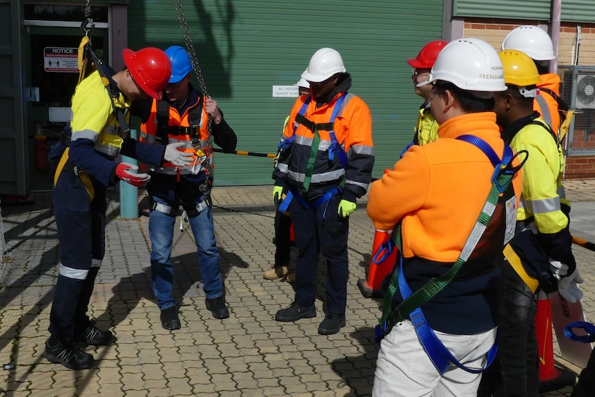 Building students on a worksite