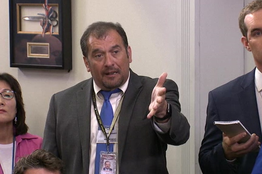 Reporter Brian Karem gestures during a White House press briefing.