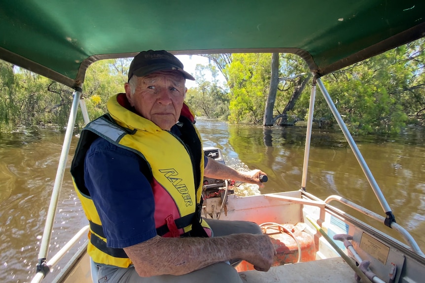 John Waters drives a motorboat