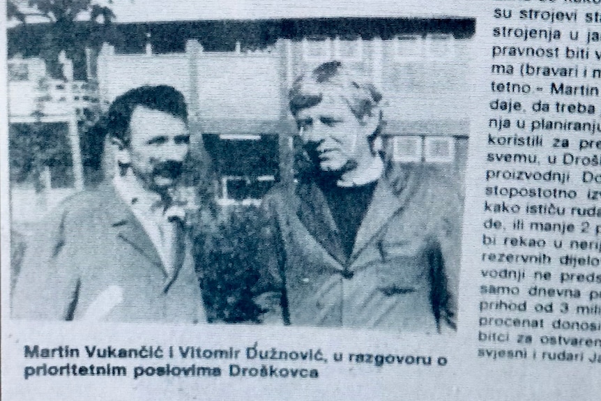 Two mine managers in a black and white picture in a Bosnian newspaper.