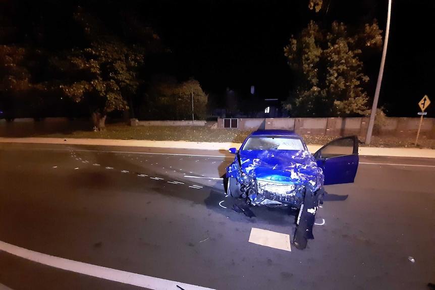 A badly damaged Ford Falcon.