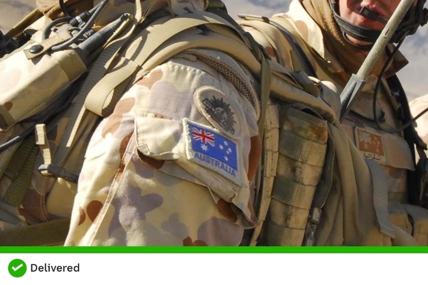 The shoulder of a man wearing an ADF camouflage uniform withAustralian flag patch