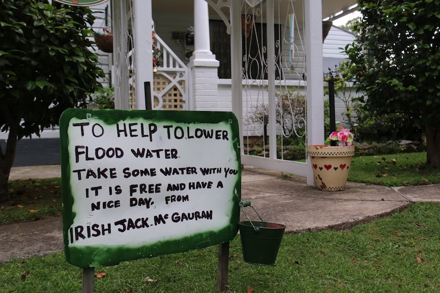 A humorous sign in the yard of a Wangaratta home about flood waters.