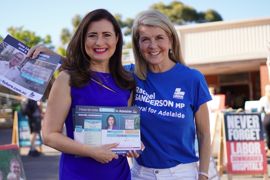 Two women wearing blue 