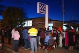 Crowd gathers outside police station