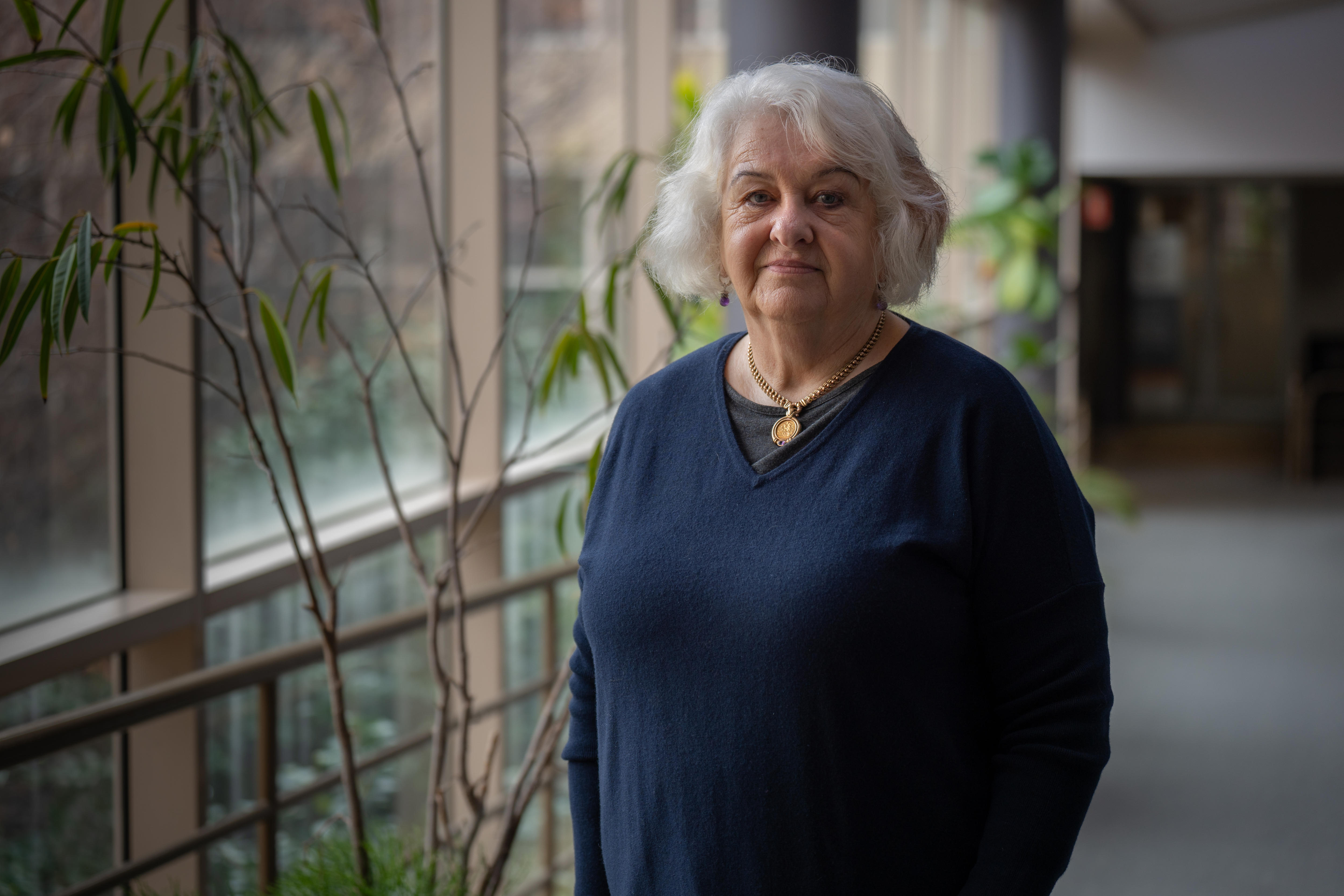 Elizabeth Little, National President Australian Association of Social Workers, has short grey hair and a faint smile on her face