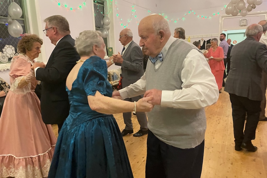 Photo of an older couple dancing.