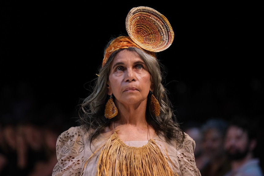 a female model wearing a headdress