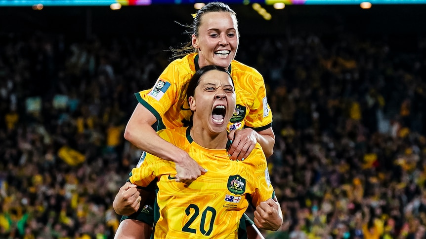 Two Matildas players celebrate a goal during the FIFA Women's World Cup.