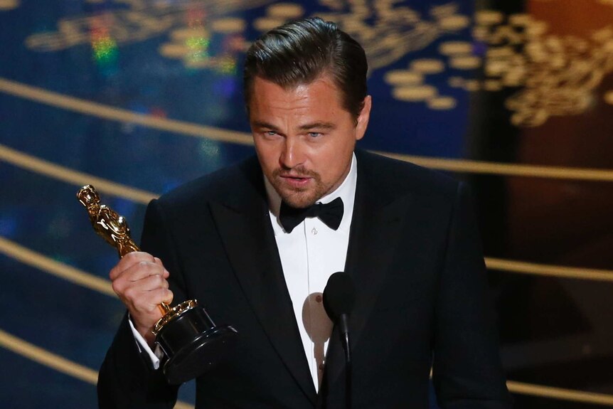 Leonardo DiCaprio accepts his Oscar award