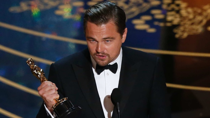 Leonardo DiCaprio accepts his Oscar award