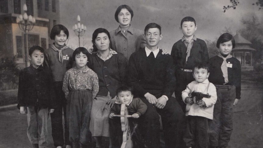 A black and white photo of a family in China