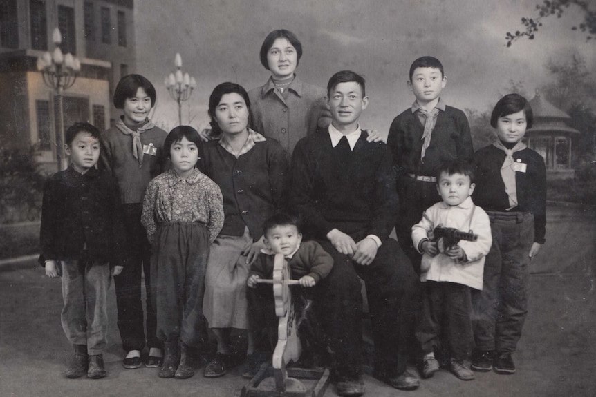 A black and white photo of a family in China