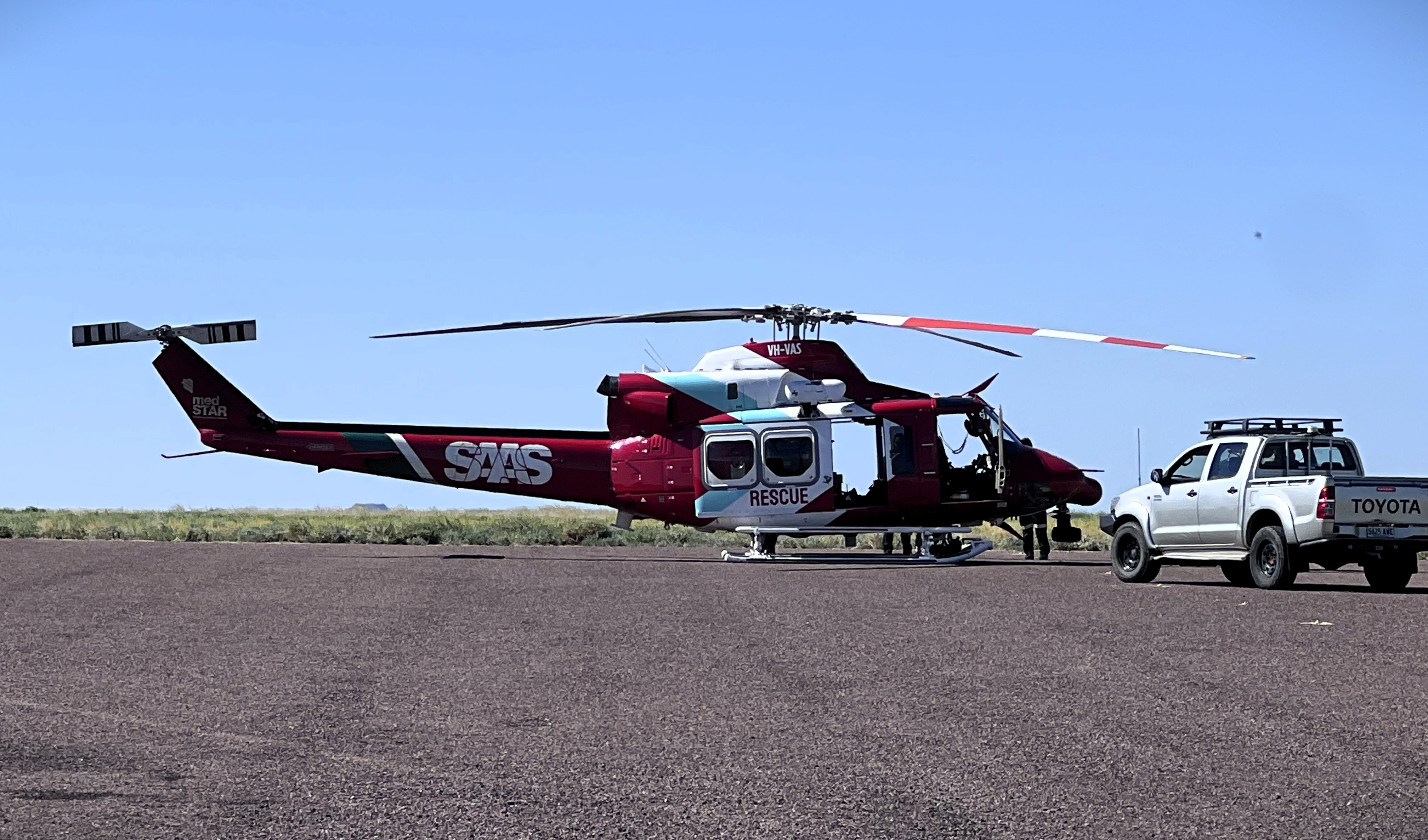 A SAAS helicopter on tarmac.
