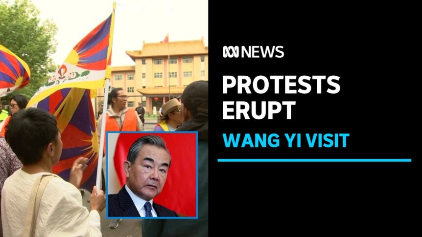 Protests Erupt, Wang Yi Visit: Pro-Tibet protesters wave flags with a small inset photo of the Chinese foreign minister Wang Ye.