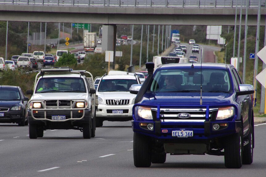 Cars travel along a busy Roe Highway in Perth,