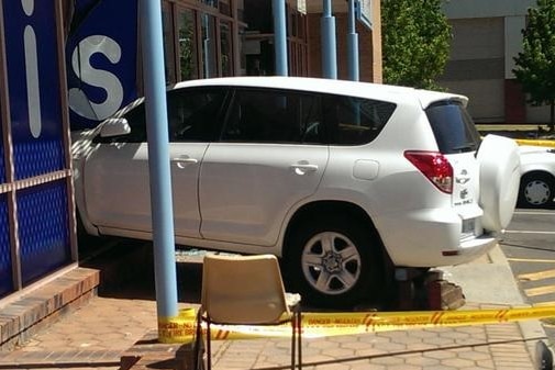 The car crashed through the window of the Vinnies shopfront in Tuggeranong.