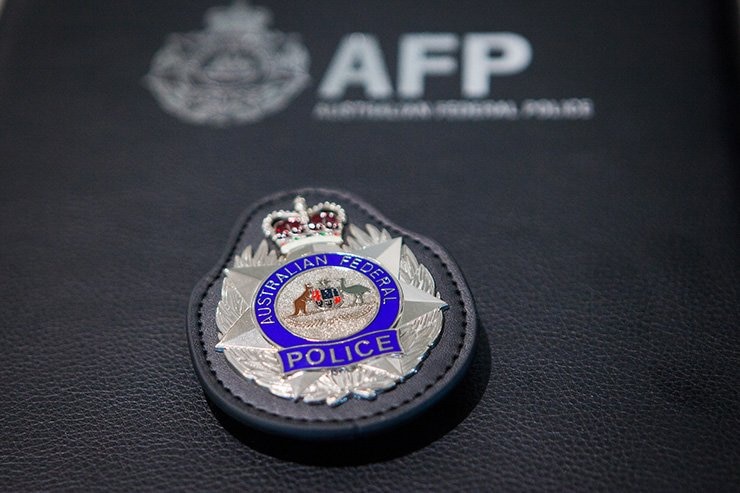 A close up of the Australian Federal Police badge